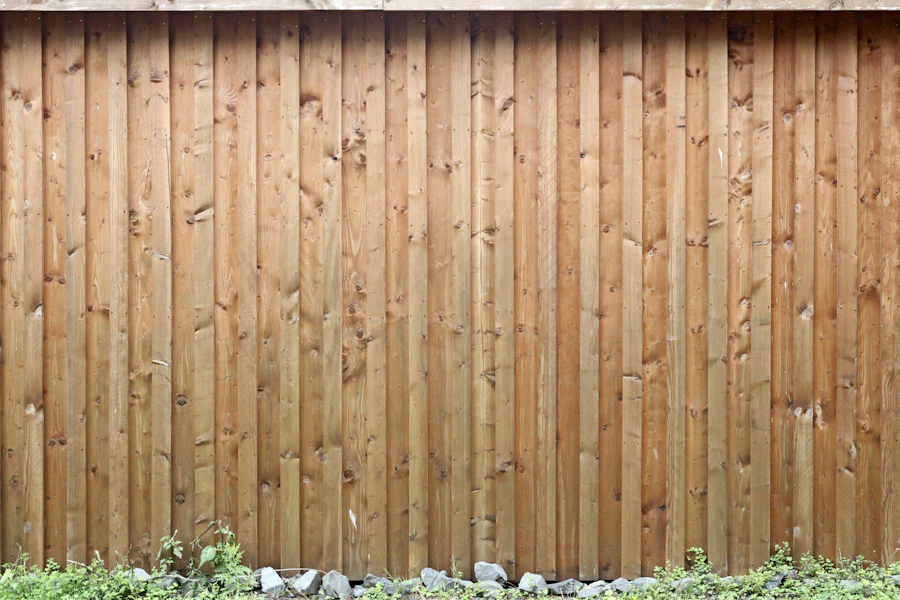 Vertical-board wooden privacy fence filling the frame