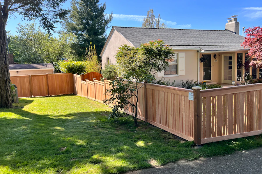House with a wooden fence along the front yard